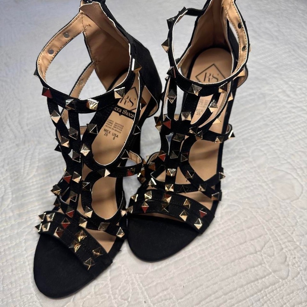Black studded heels with gold studs